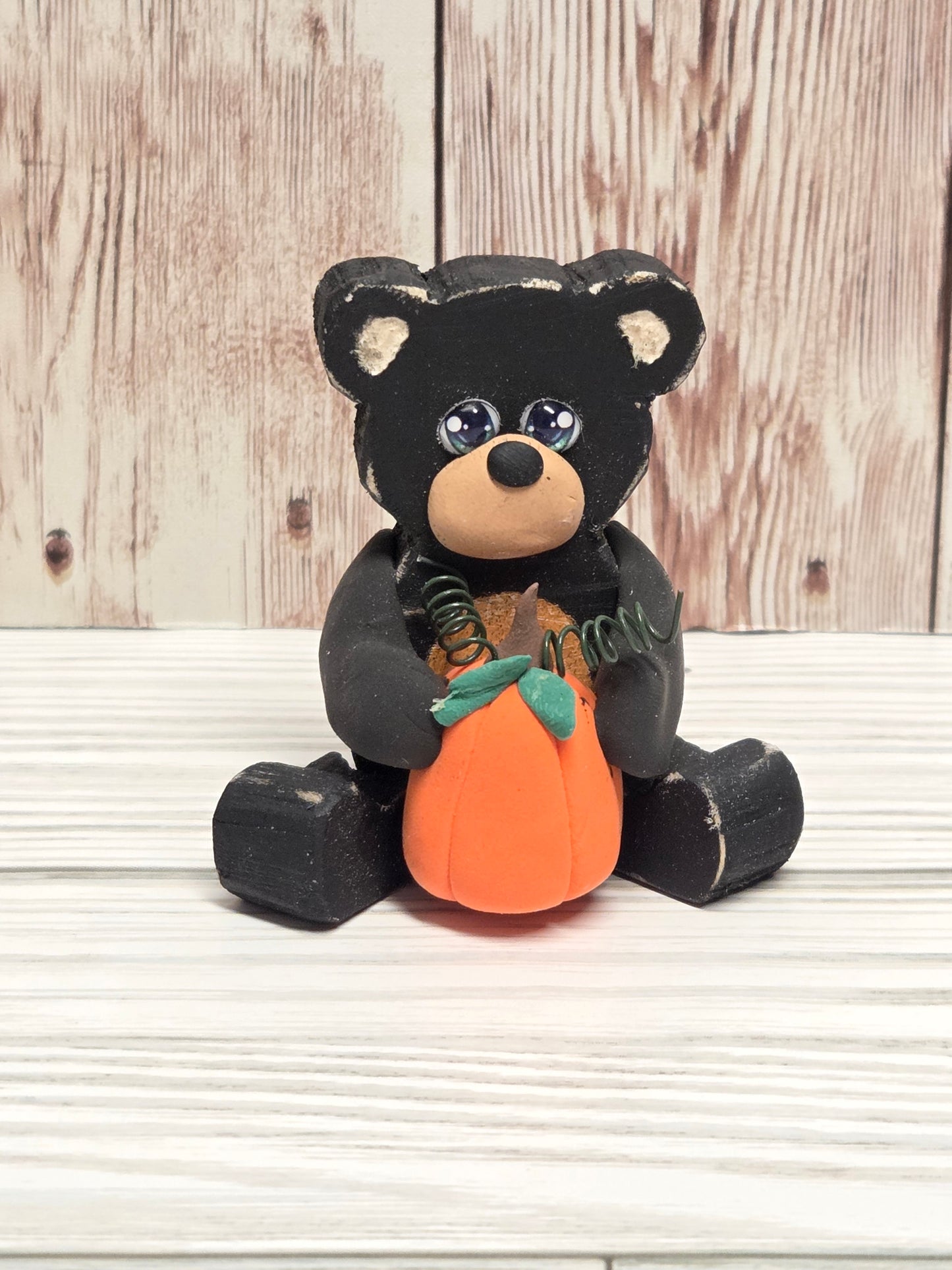 Sitting Wooden Bear with Pumpkin